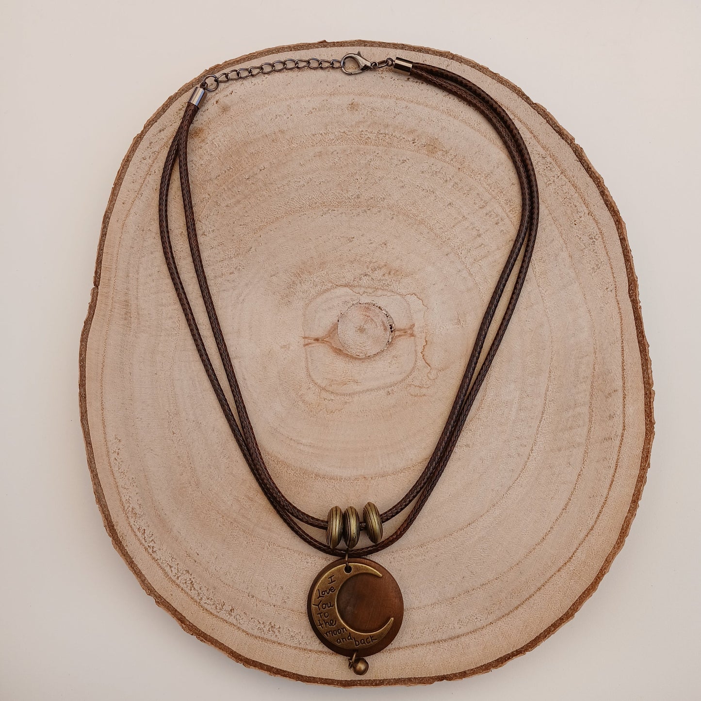 Necklace with a pendant on a wooden surface